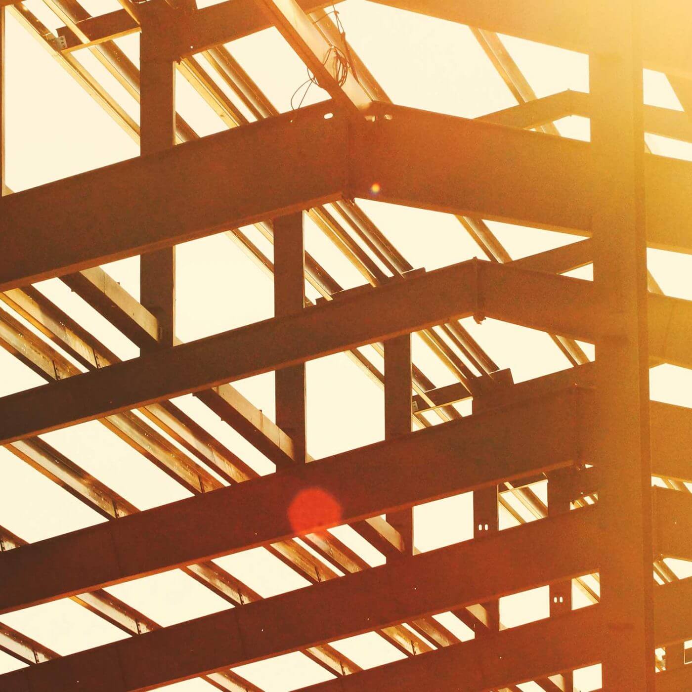 A closeup of beams on a building being constructed.